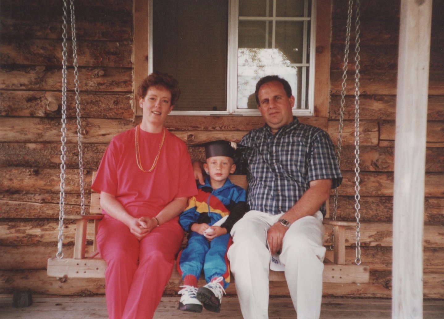 Me with my Dad and Mom at my preschool graduation.